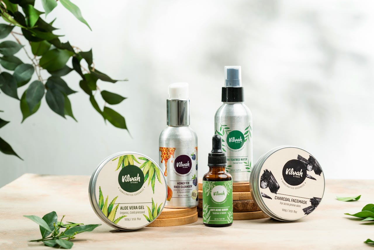 hero-img Close-up of natural skincare products including aloe vera gel and charcoal face mask.